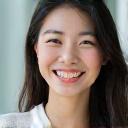 Photo of Yuki Tanaka, a young woman with bright eyes and a cheerful smile.